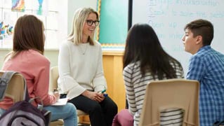 school psychologist talking to students