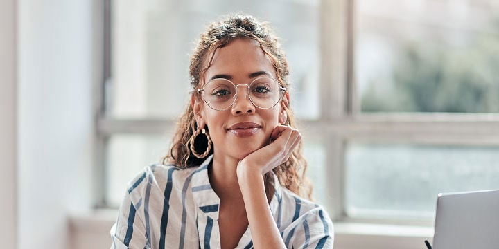 woman with glasses and striped shirt