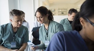 Medical professionals consulting in a break room