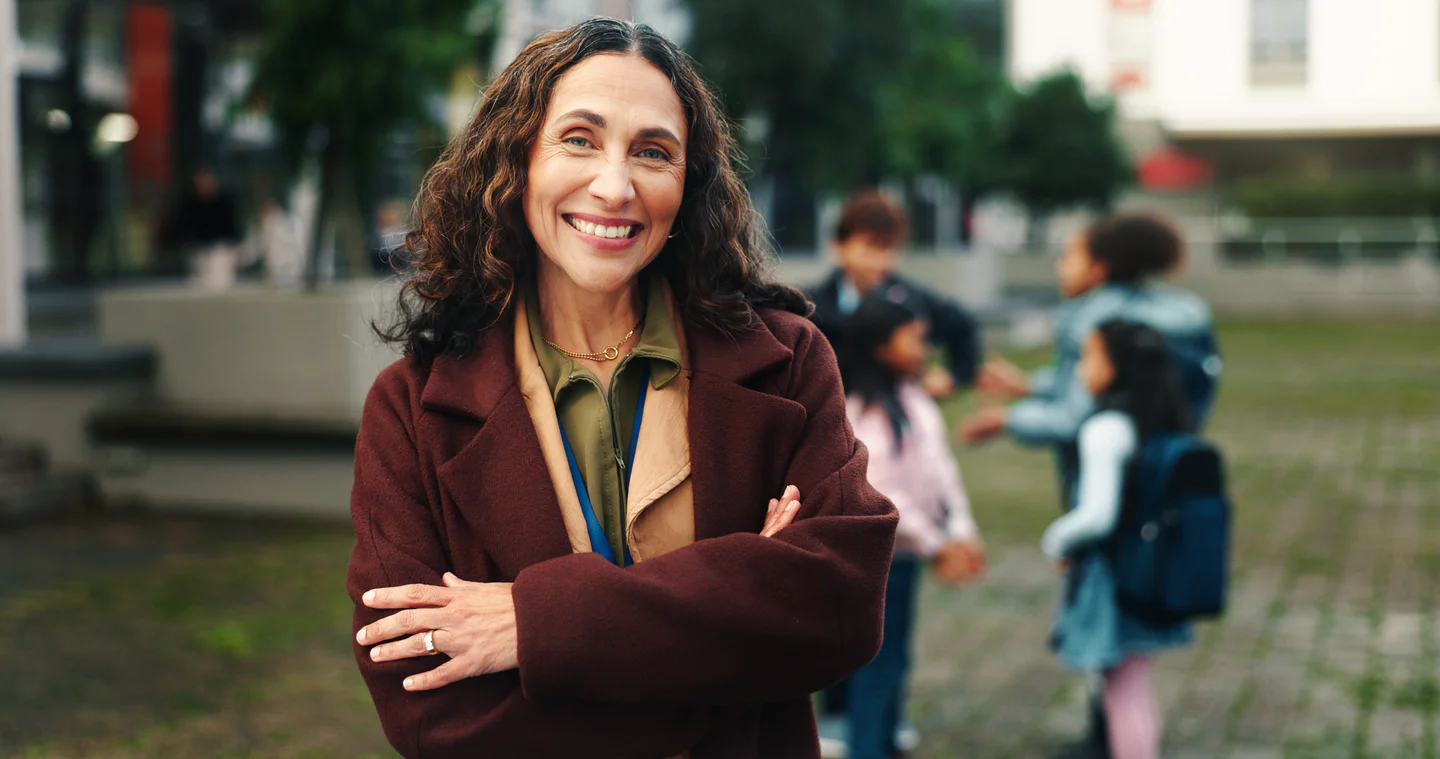 Portrayal of Capella education student with children wearing backpacks in the background.