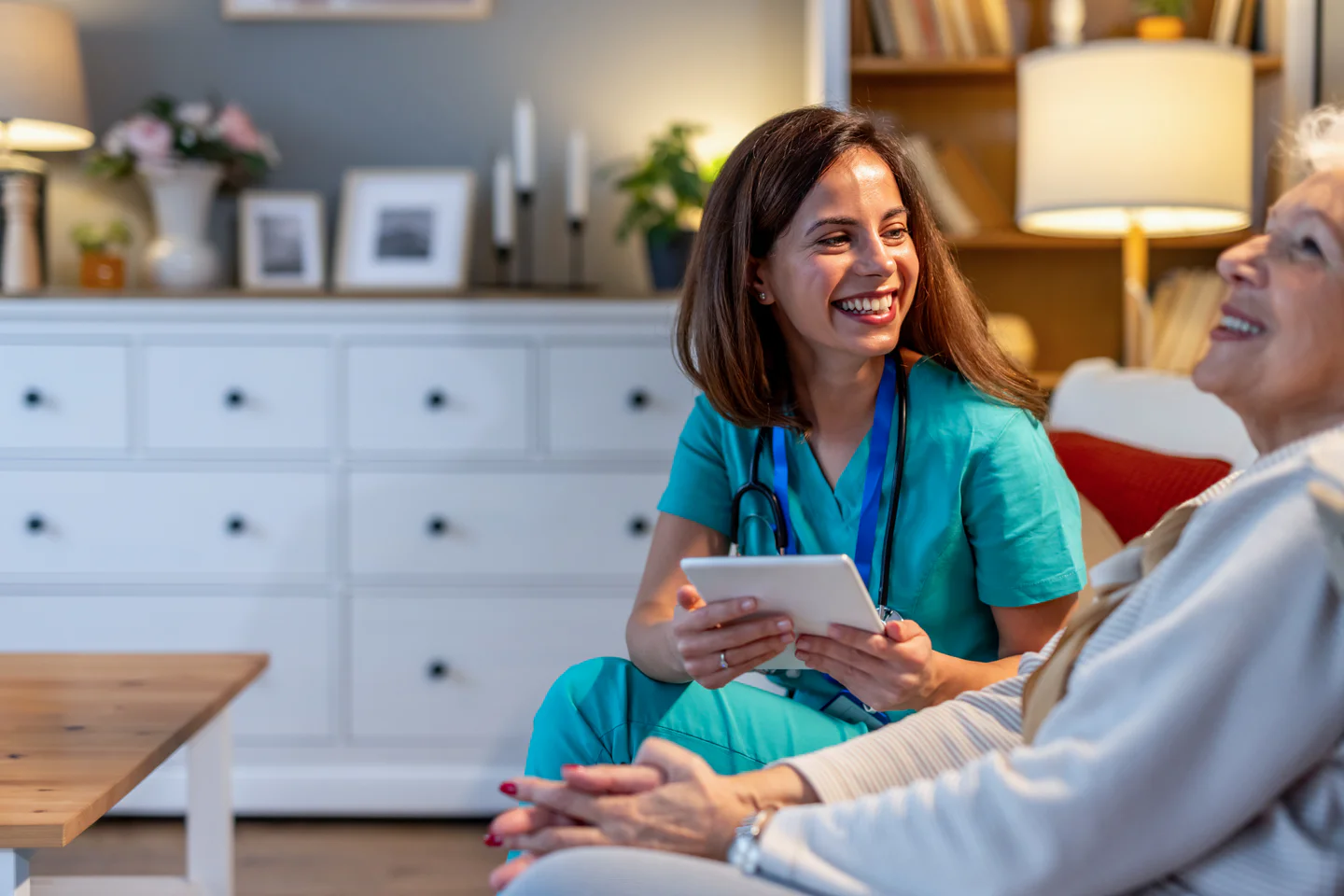 woman-nurse-comforing-elderly-patient-at-home-2