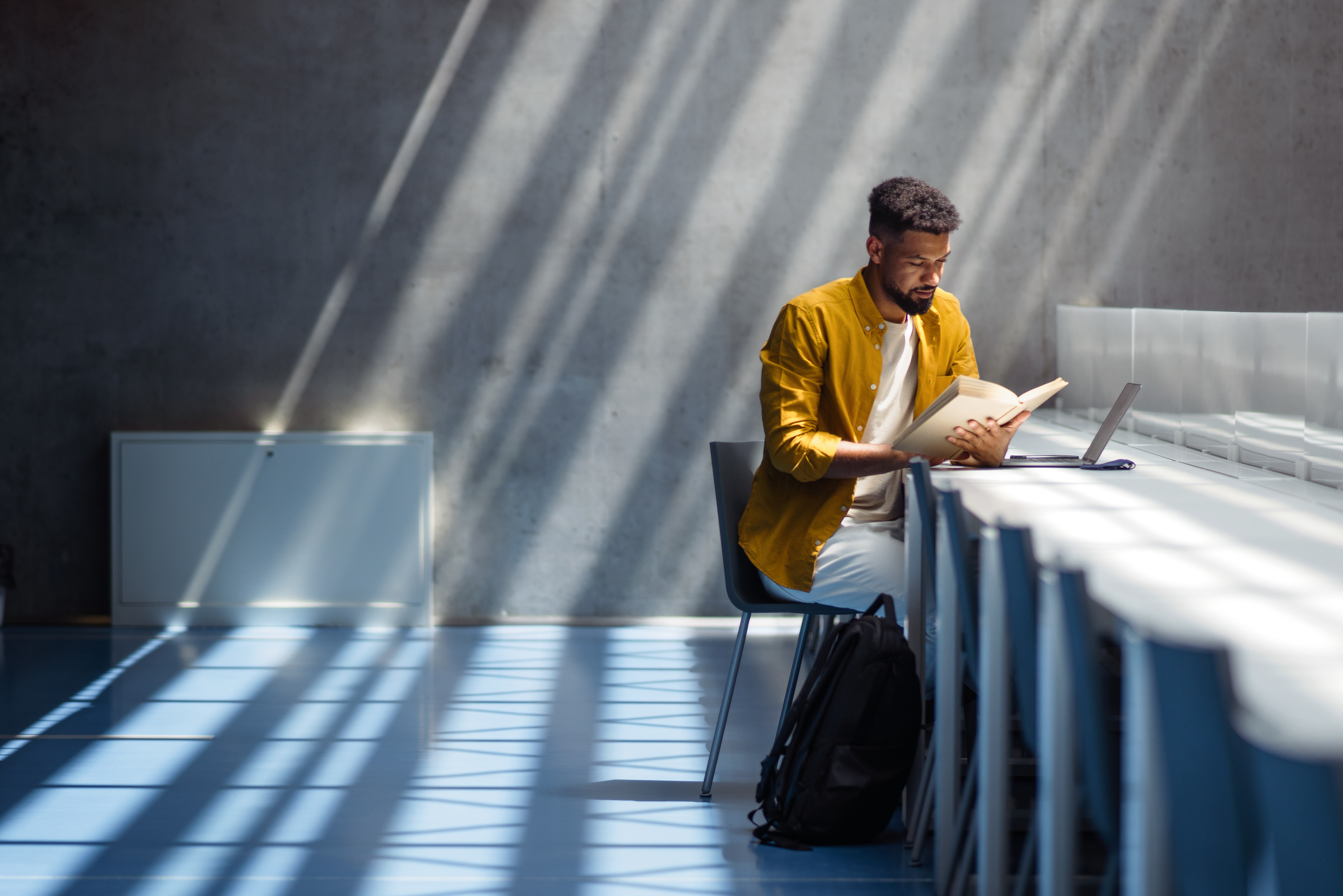 Portrayal of Capella business student reading a book