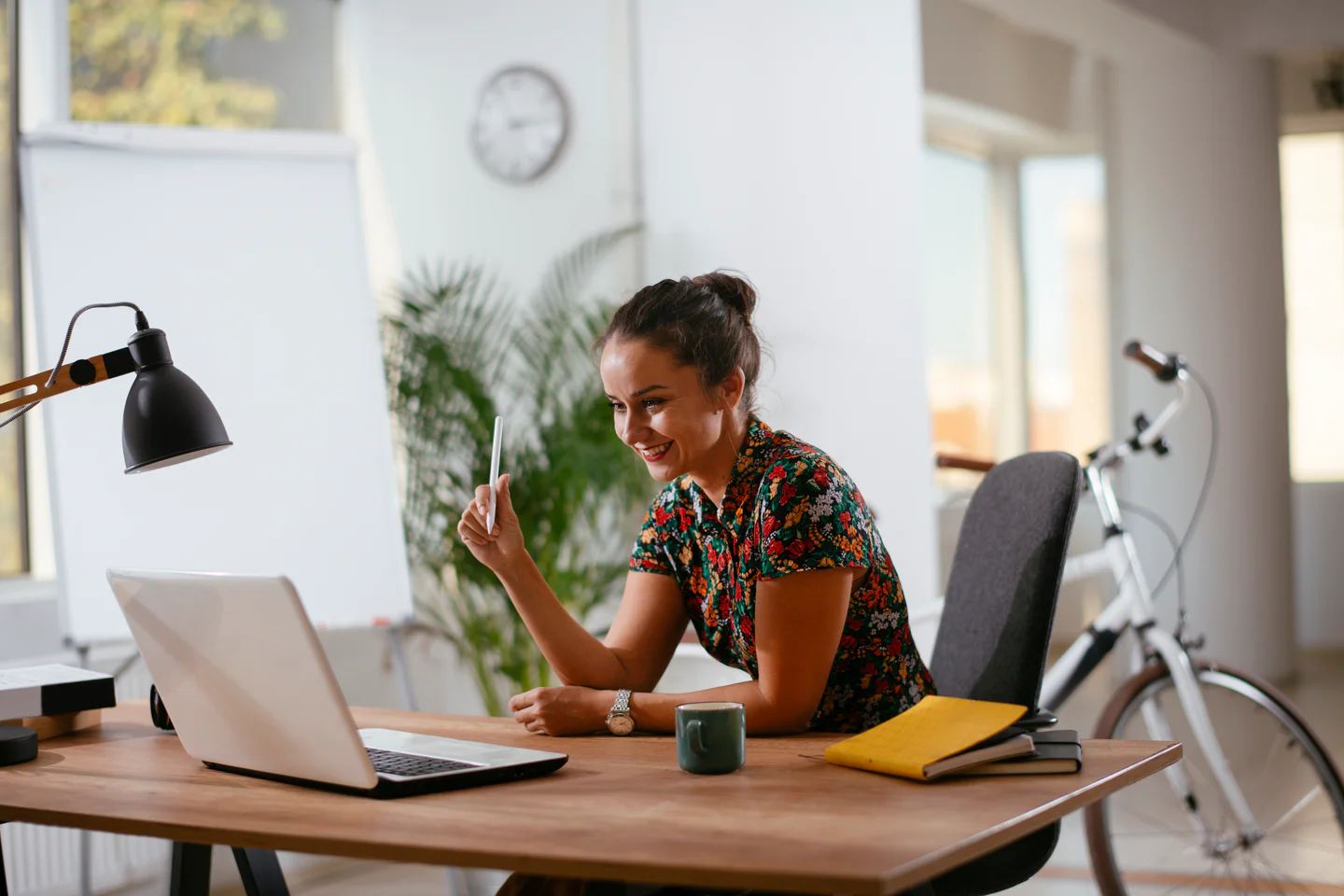 Portrayal of Capella online student sitting in her home office.