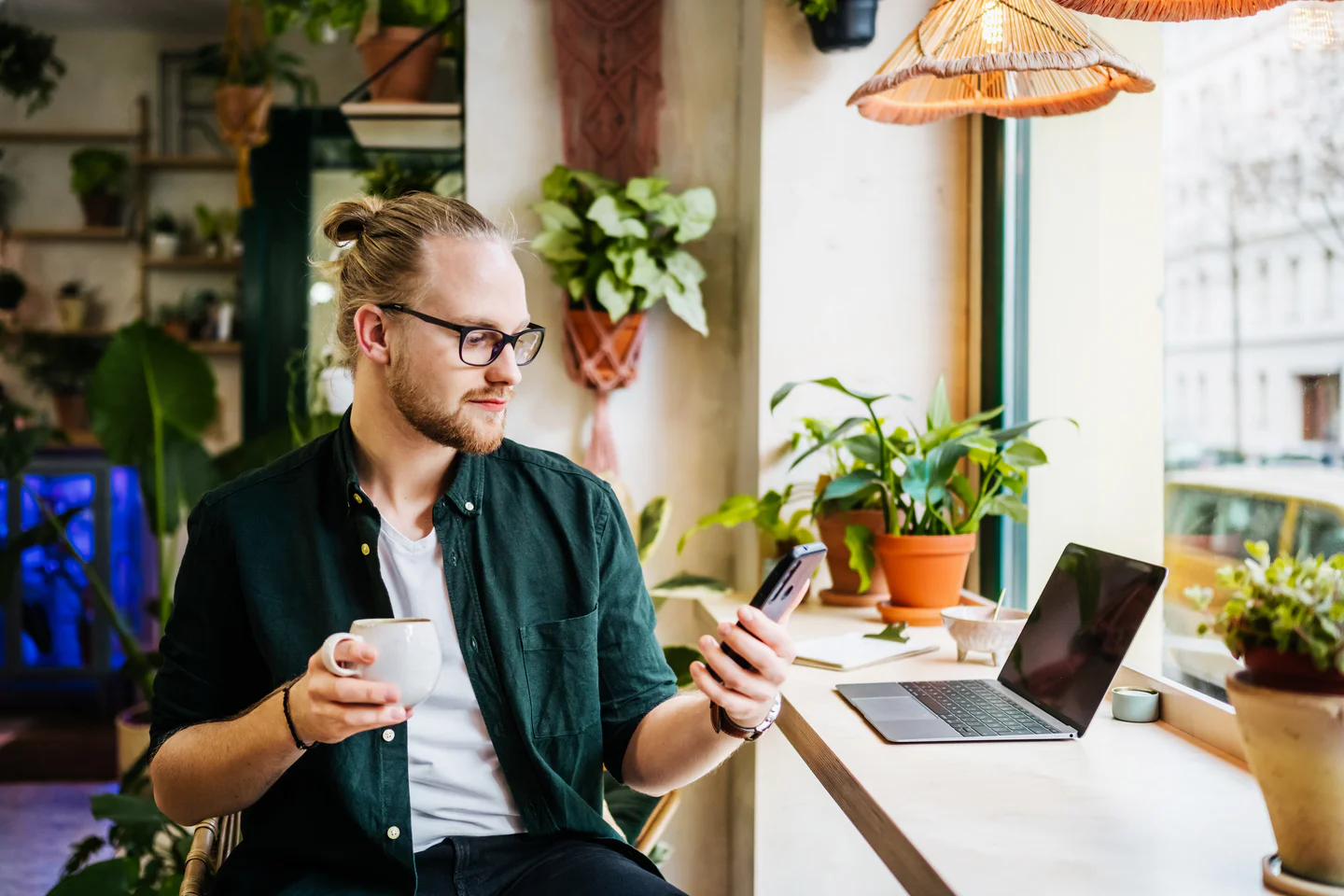 Portrayal of Capella student learning online with a smartphone.