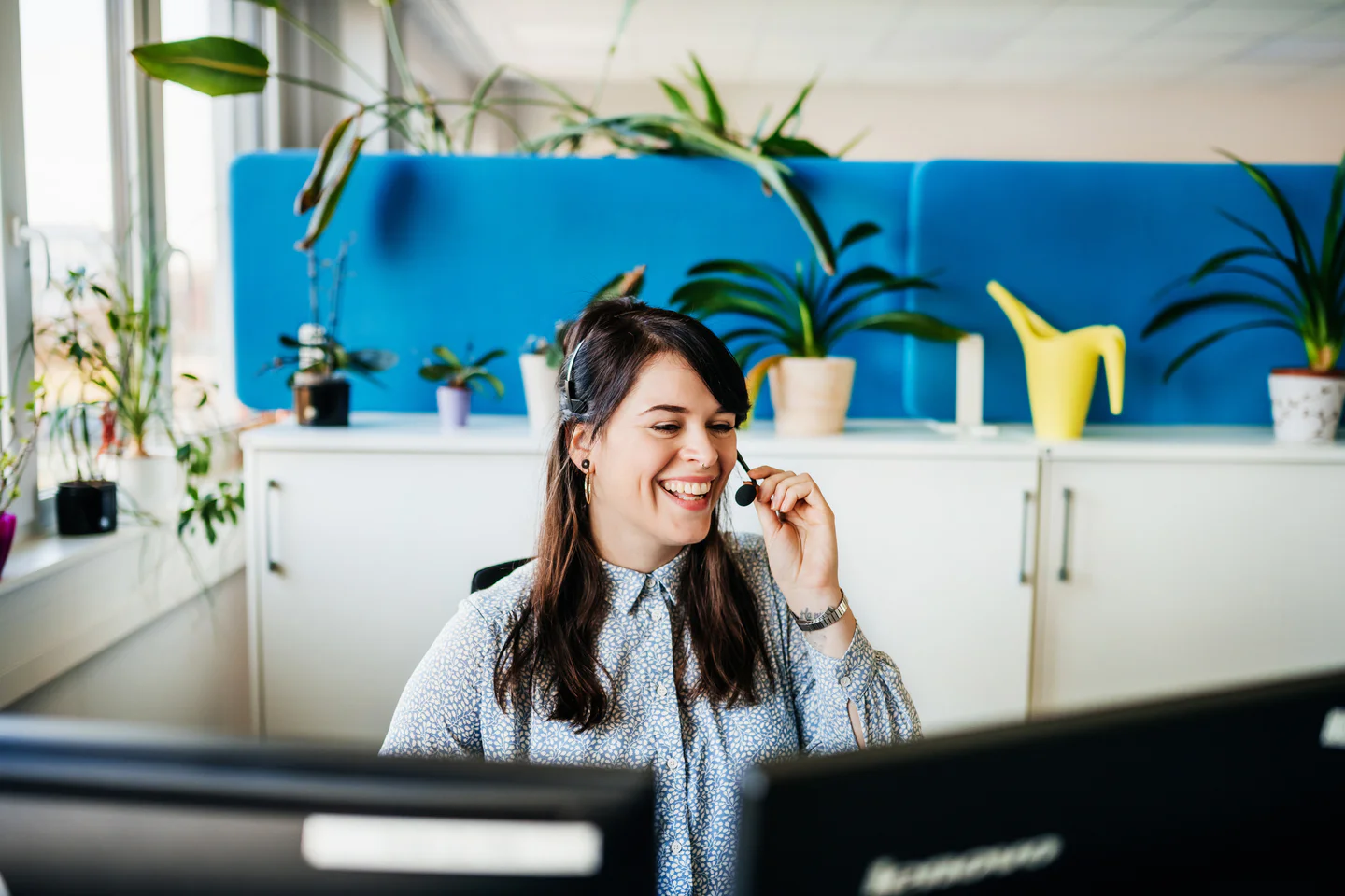 Portrayal of Capella online student talking on a headset.