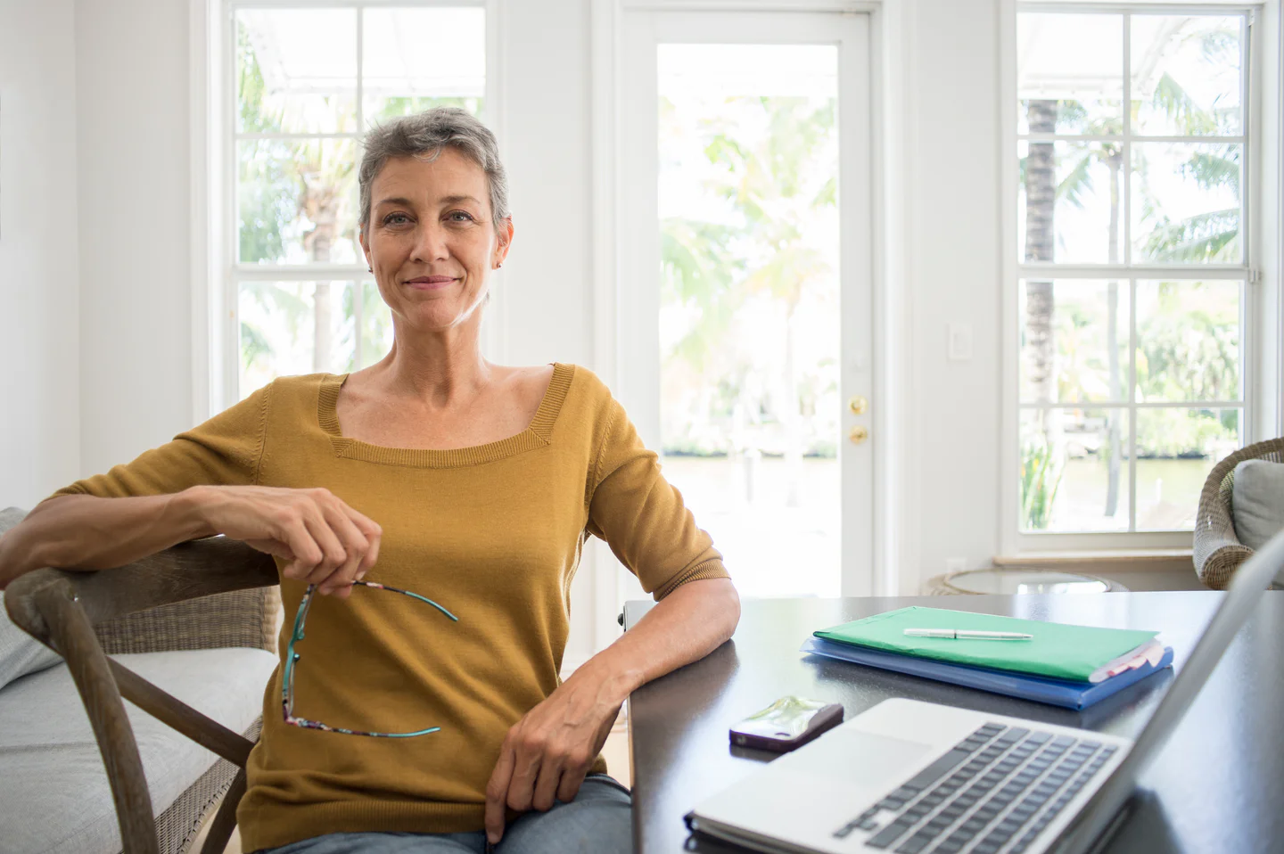 Portrayal of Capella online student sitting in her home office.