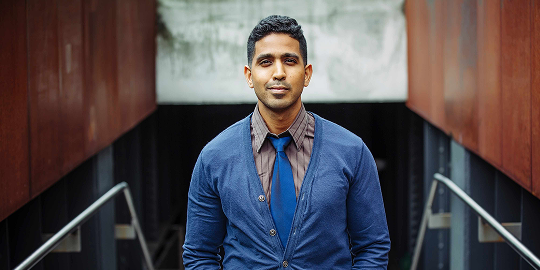 man with blue ties and blue vest