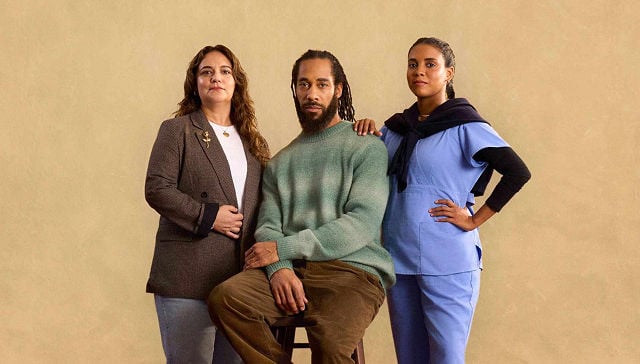 man with two women on either side