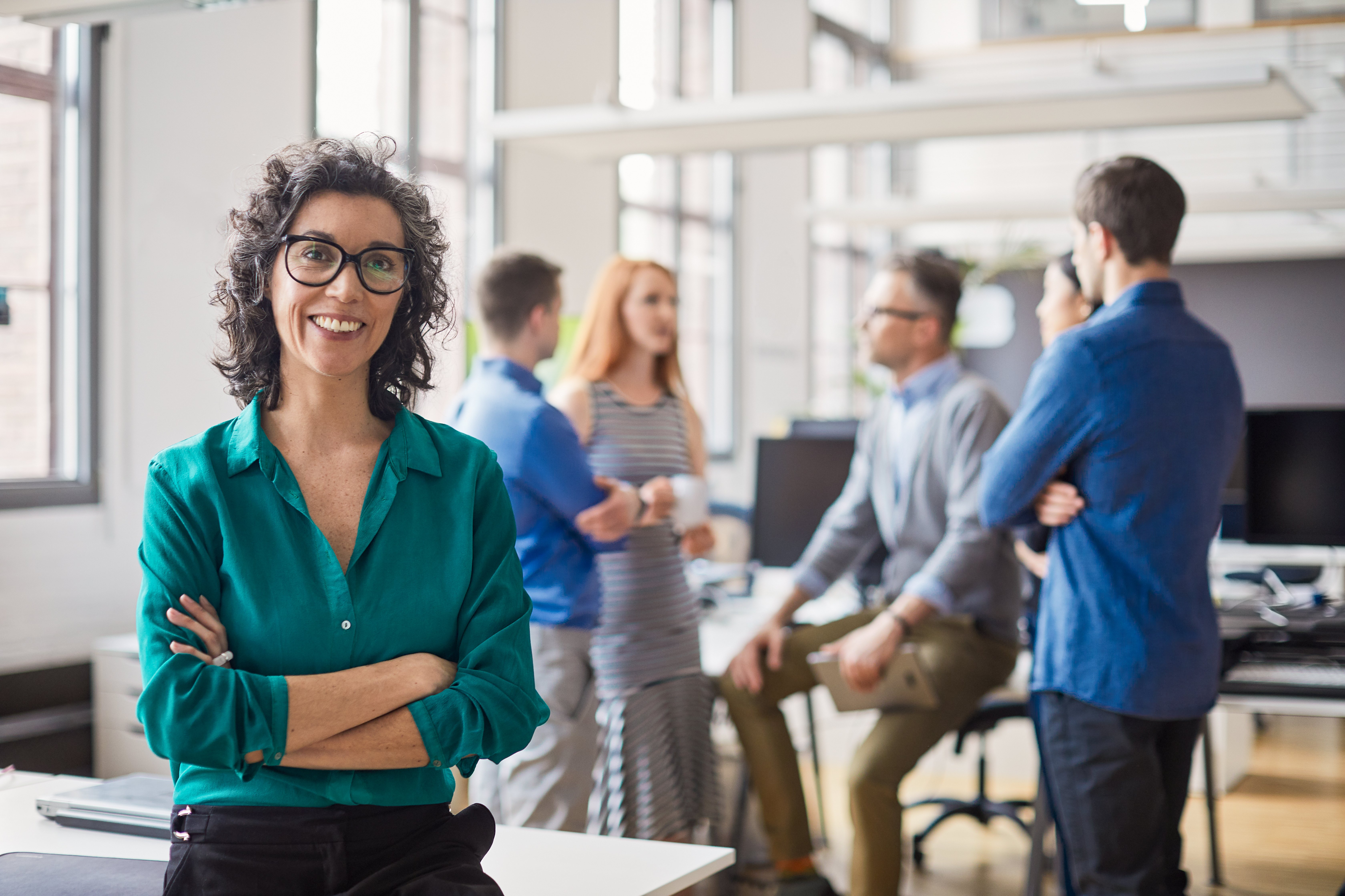 Portrayal of a Capella University online business student at a meeting