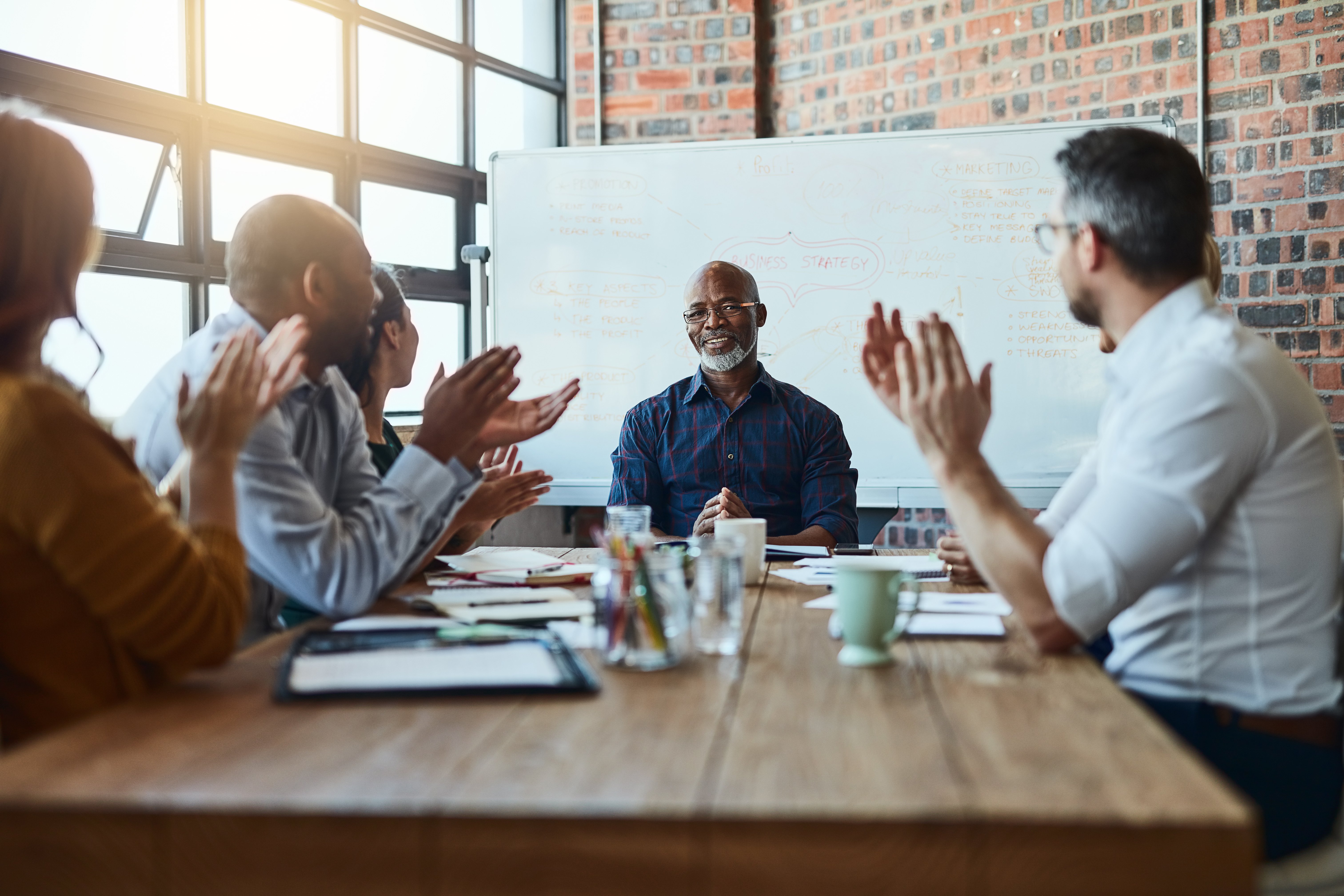 Portrayal of Capella MBA student delivering presentation to colleagues
