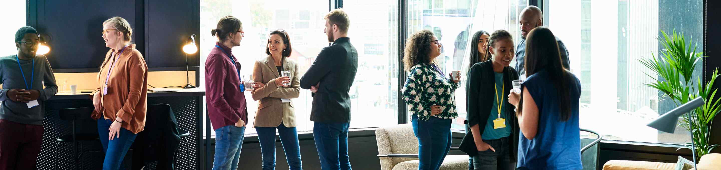 group of people talking at a networking event
