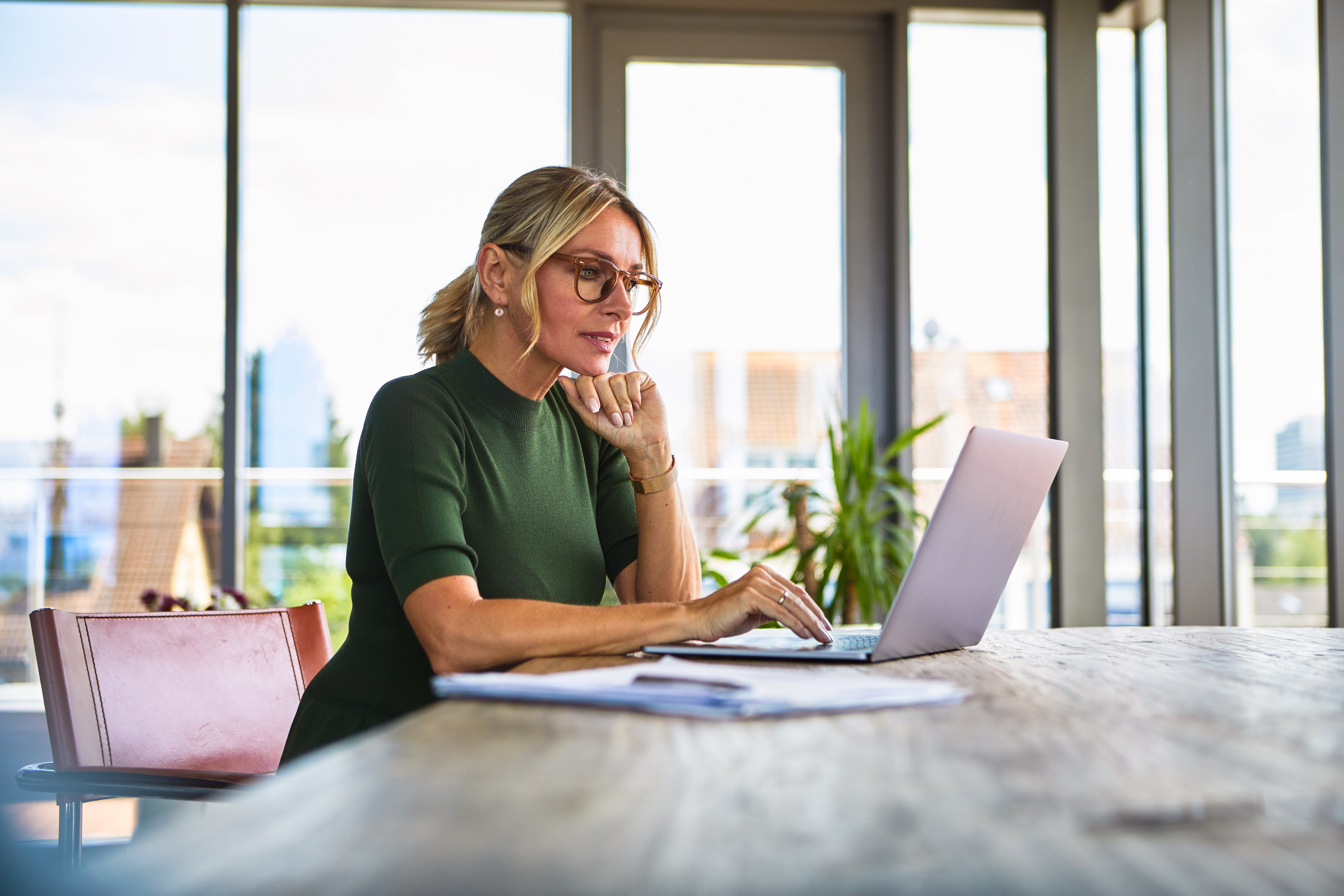 Portrayal of a Capella University online PhD student using a laptop