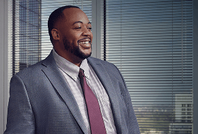 man in a suit smiling