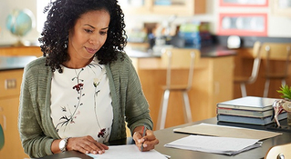 Teacher at desk