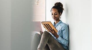 Woman at front of class smiling