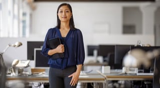 woman in blue top smiling