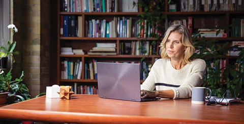 woman at desk on laptop