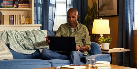 man studying online at home