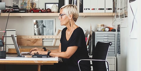 blonde woman at desk