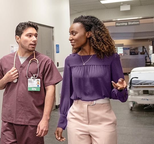 nurses talking in hallway