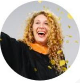 carrie-strati laughing profile wearing academic dress